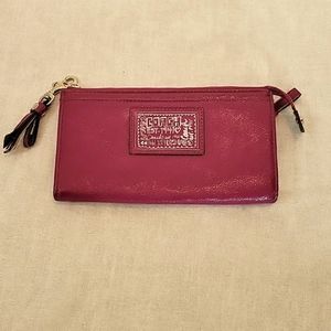 Coach berry-colored wristlet